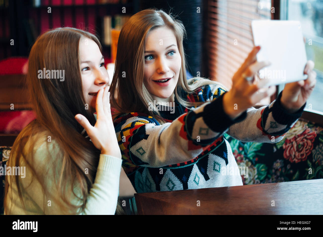 Selfie girls in cafe Stock Photo