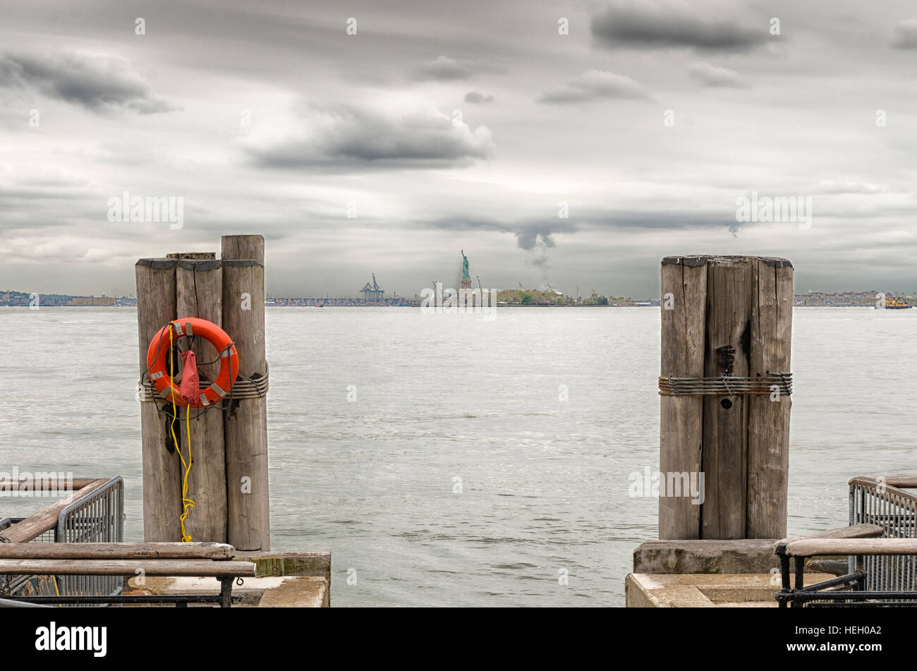 Vintage image of the Statue of Liberty at the horizon seen from Battery park in lower Manhattan Stock Photo