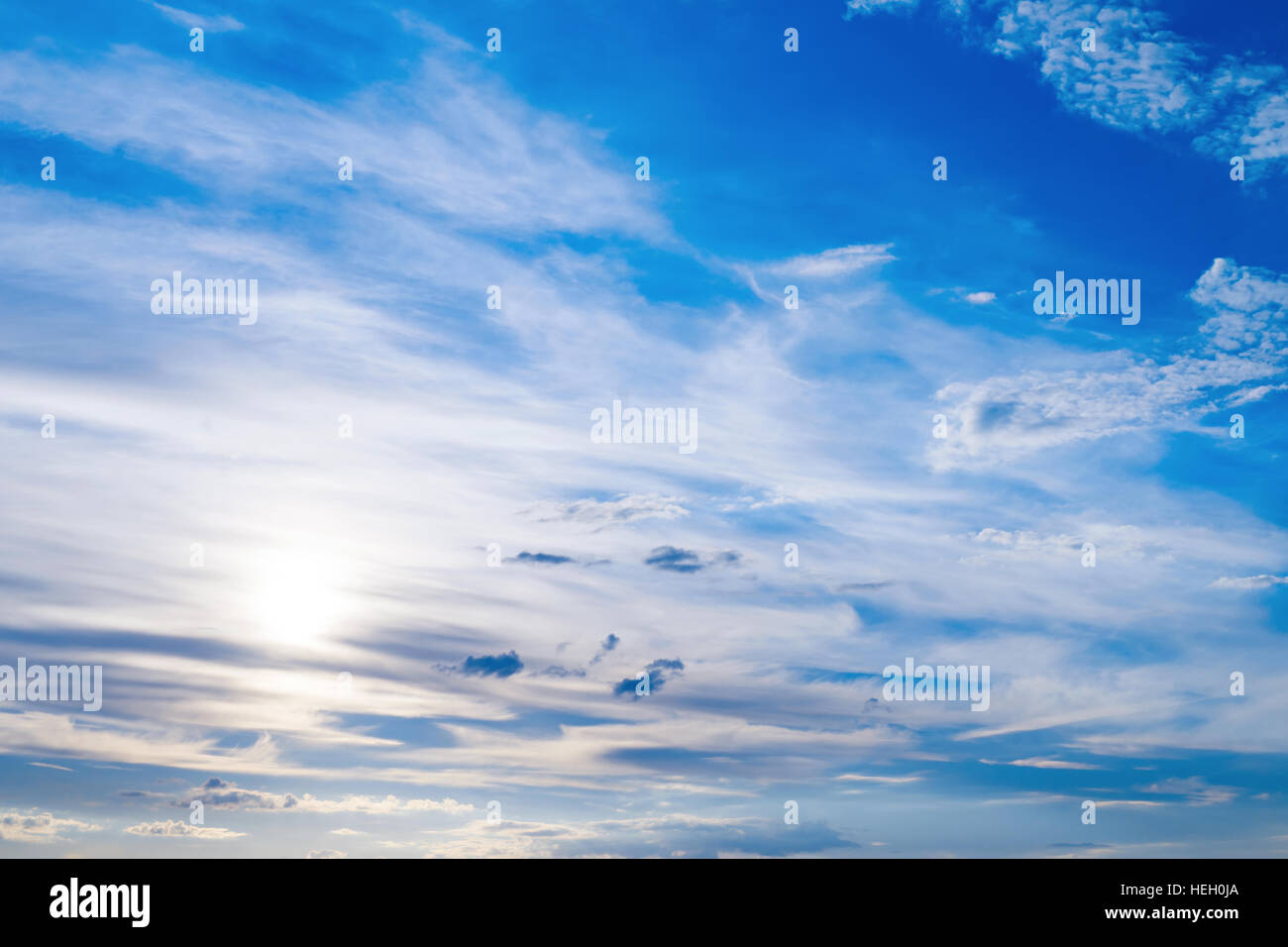 Cloudscape with a sun. Natural sky background Stock Photo - Alamy