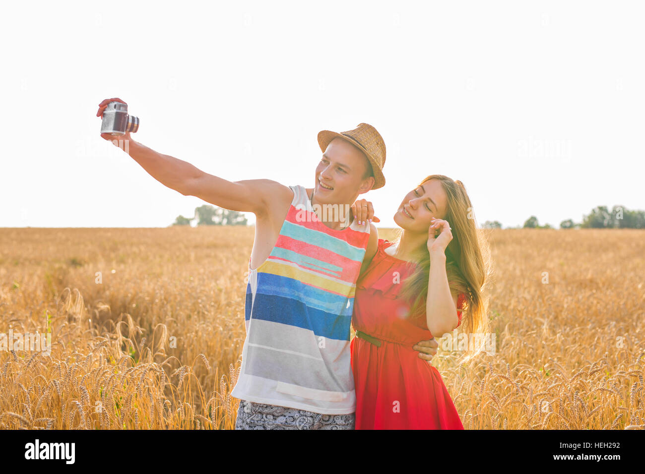 Young happy couple taking a selfie in the field Stock Photo - Alamy