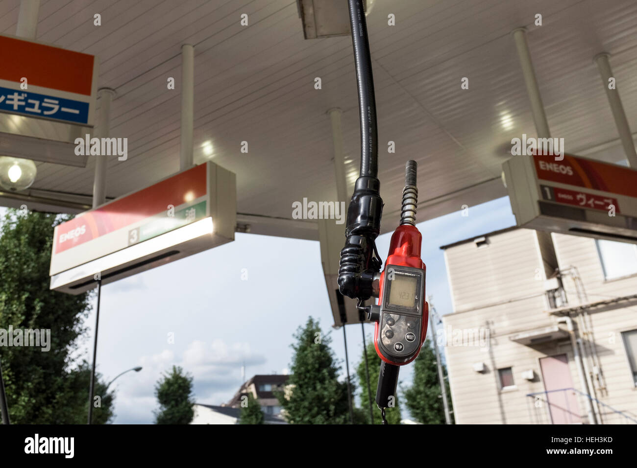 A hanging nozzle at a petrol, gas, station in Tokyo, Japan. Stock Photo