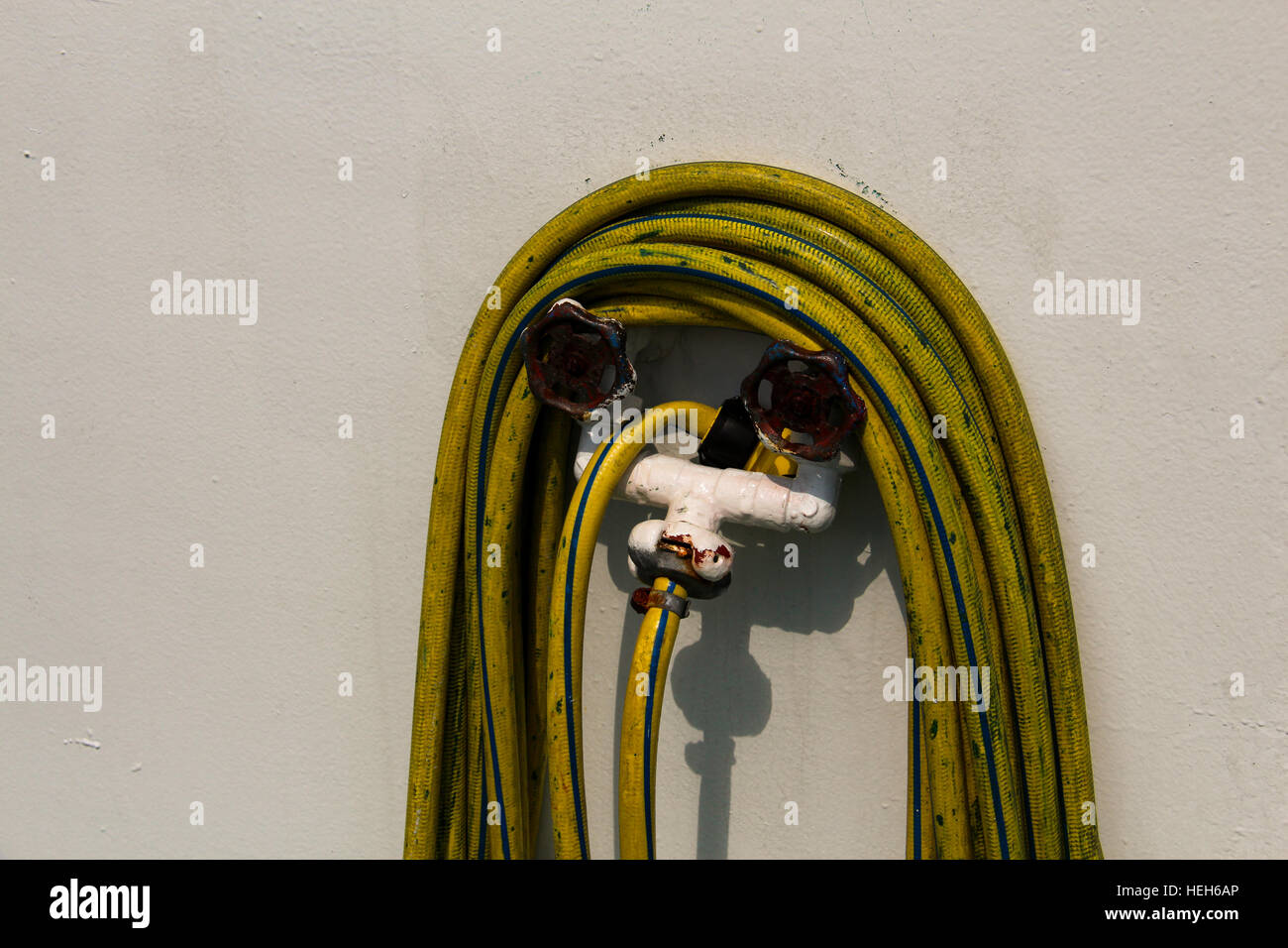 Yellow hose reel Black and White Stock Photos & Images - Alamy
