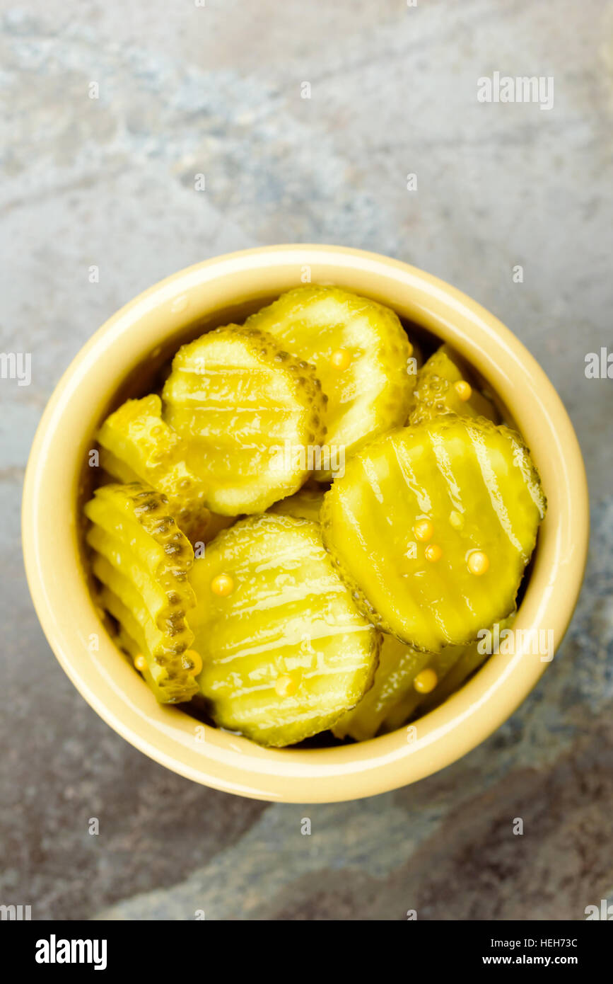 Fresh homemade pickled cucumber with mustard seeds in small ceramic bowl Stock Photo