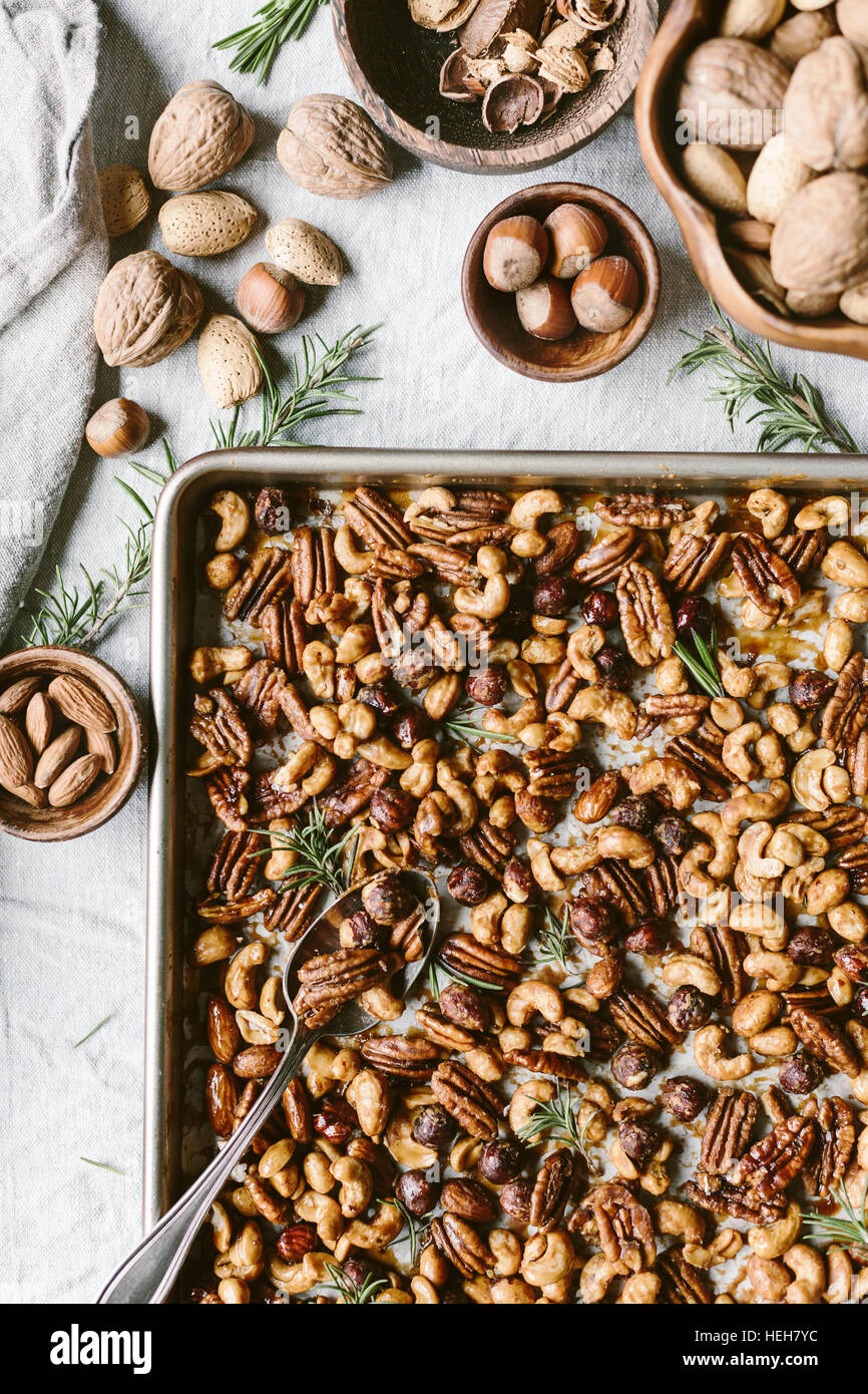 Spicy candied nuts are flavored with fresh rosemary leaves and