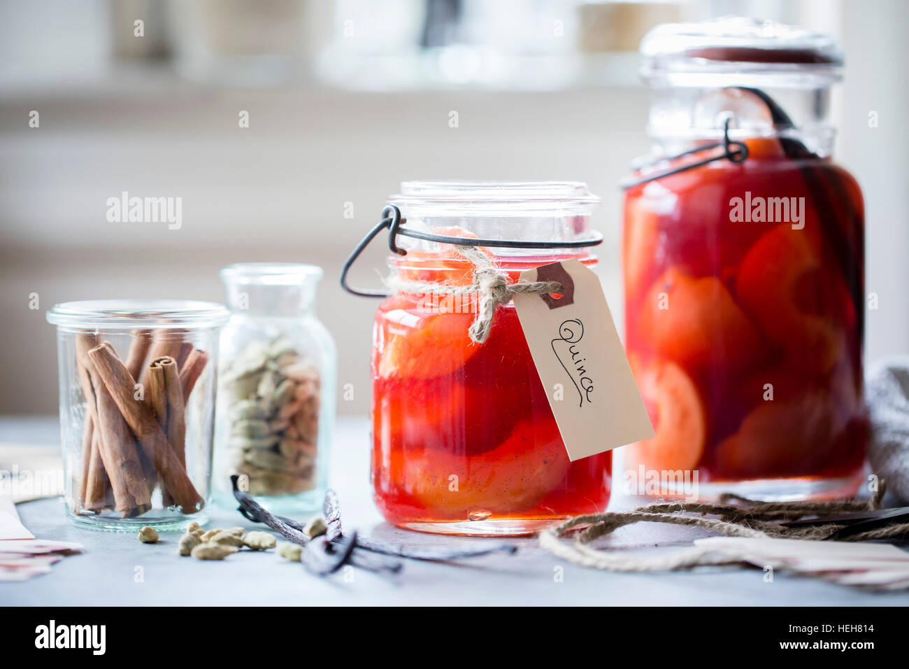 Poached Quince Fruit in a preserving mason jar. Stock Photo