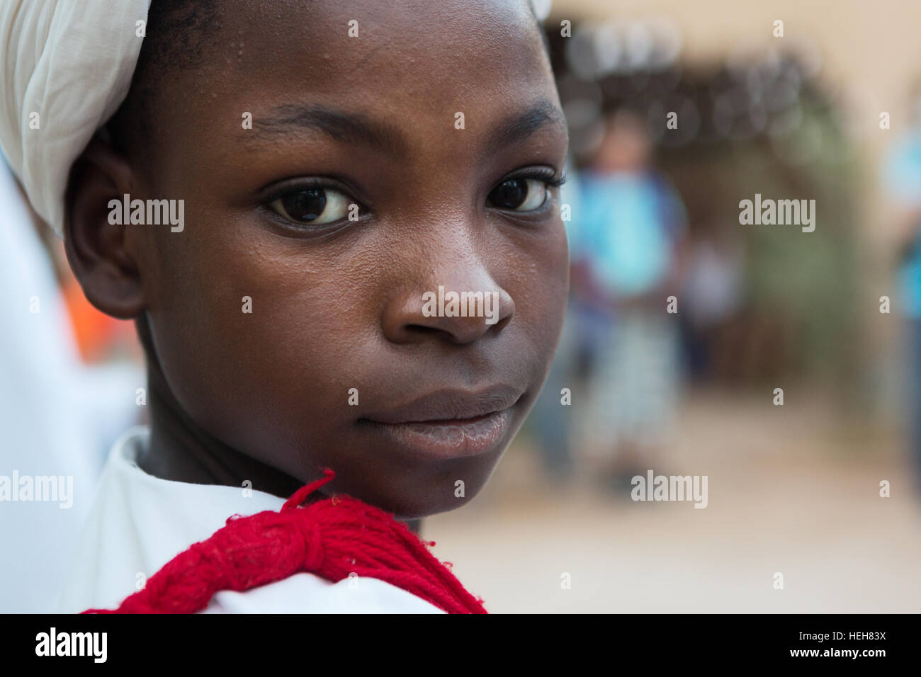 Traditionally dressed unidentified tribal child looking over his shoulder. Stock Photo