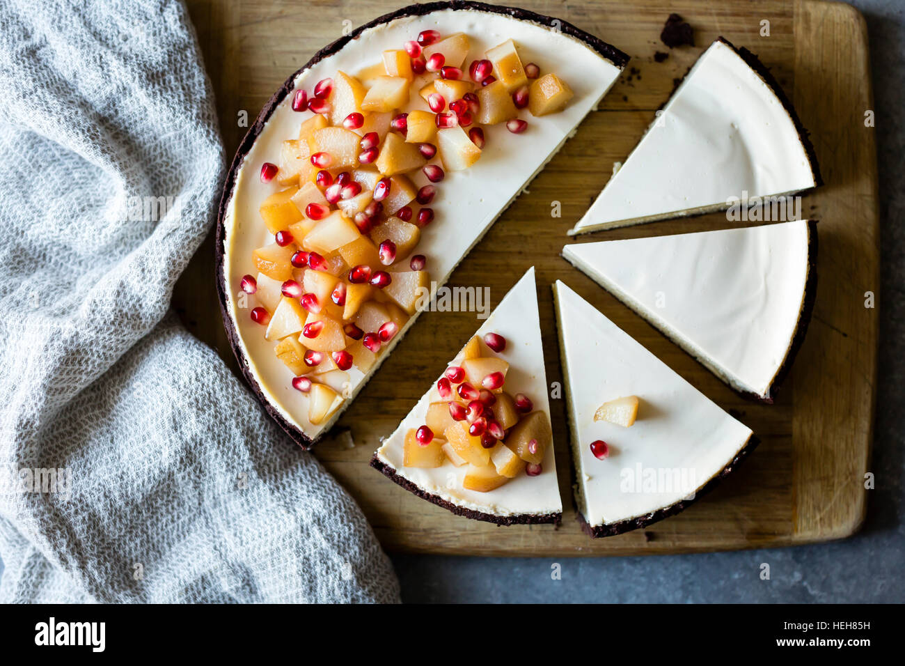 Chocolate Crusted Chèvre Cheesecake with Earl Grey Poached Pears & Pomegranate (gluten-free) Stock Photo