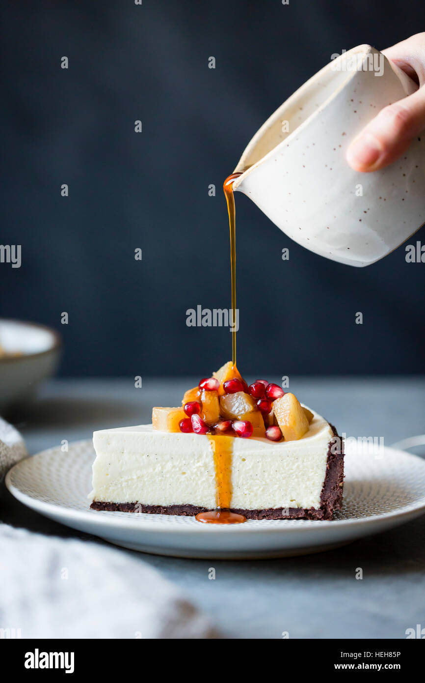 Chocolate Crusted Chèvre Cheesecake with Earl Grey Poached Pears & Pomegranate (gluten-free) Stock Photo