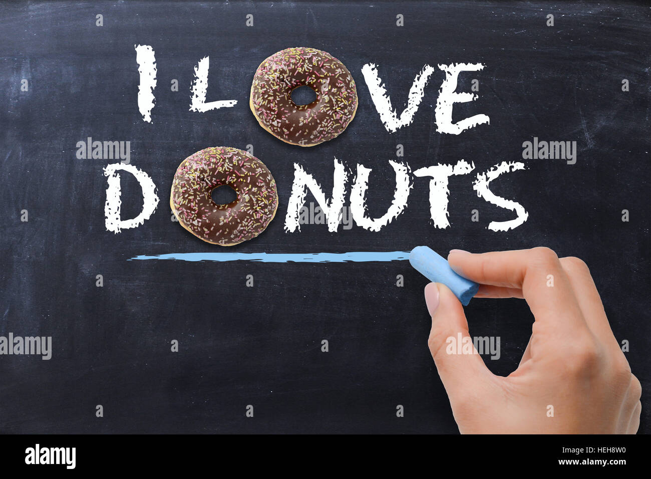 “I love donuts” concept with tasty chocolate donut on dark background Stock Photo