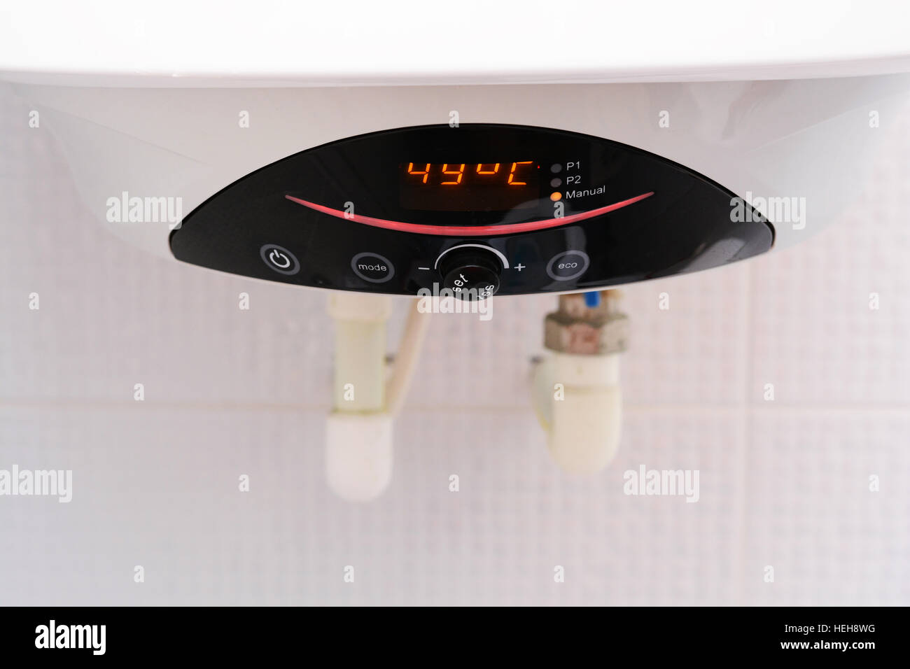 Electric water heater or boiler inside the house Stock Photo