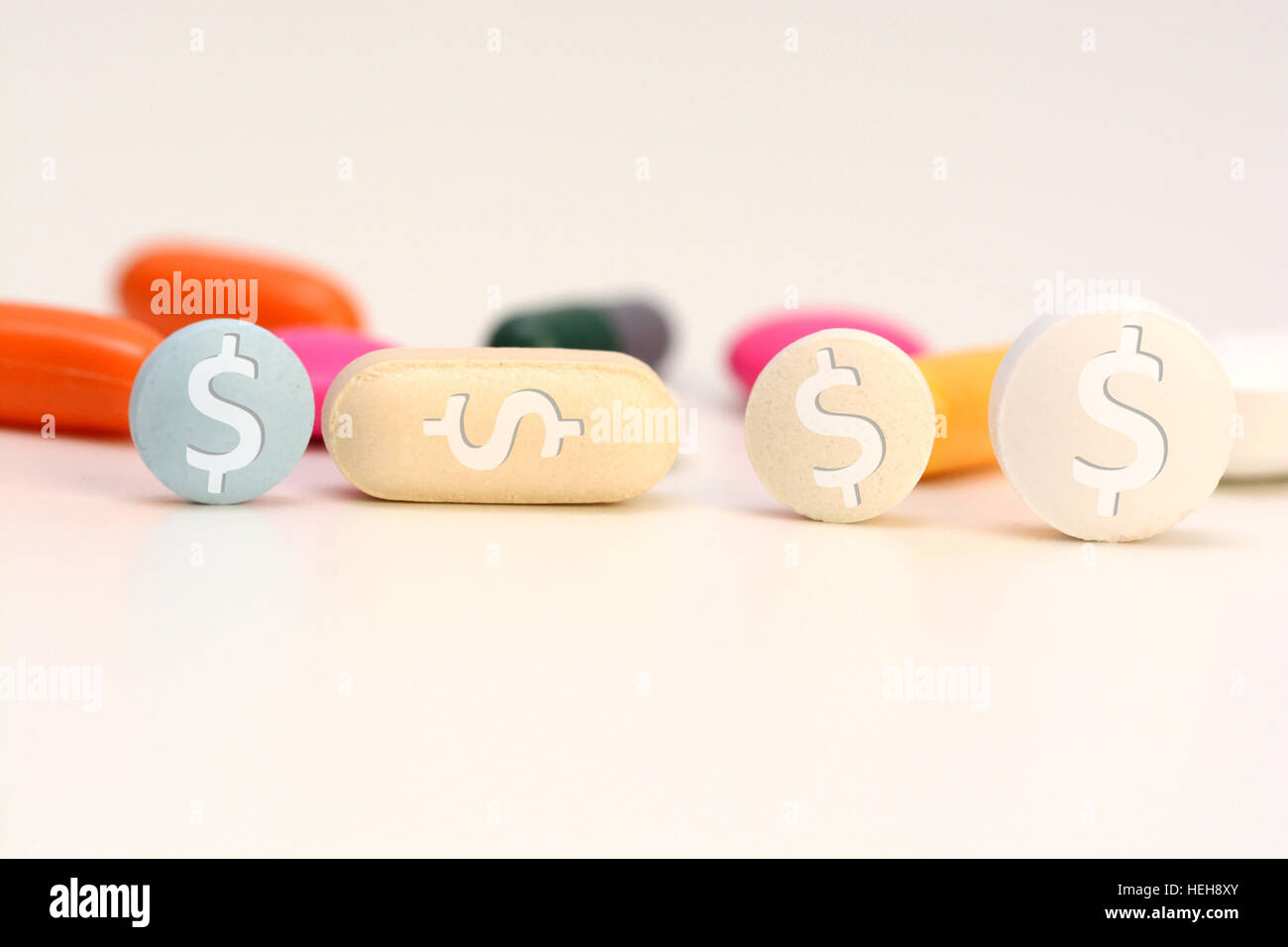 Healthcare cost concept with multicolored medical drugs with us dollar symbol Stock Photo