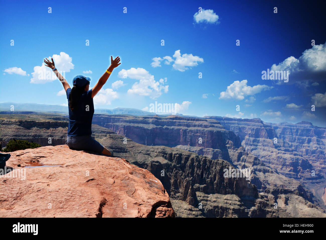 Tourist looking out over Grand Canyon National Park, Colorado River and Skywalk Stock Photo