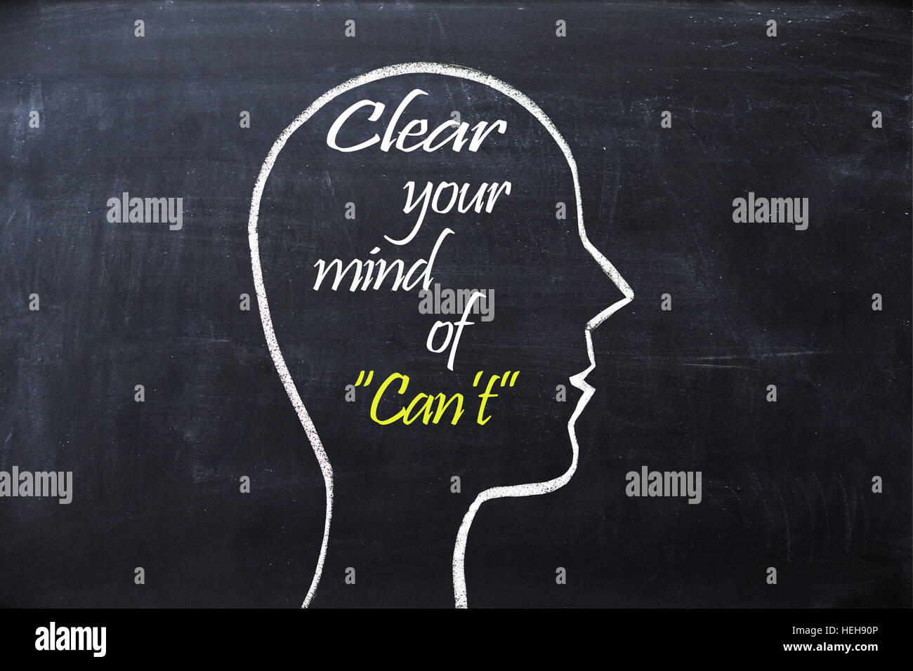 Clear your mind of can't phrase inside human head shape drawn on chalkboard Stock Photo
