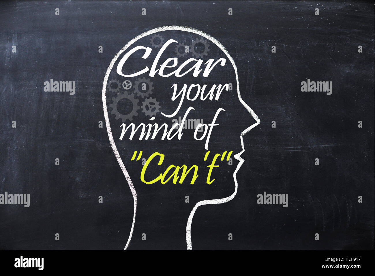 Clear your mind of can't phrase inside human head shape drawn on chalkboard Stock Photo