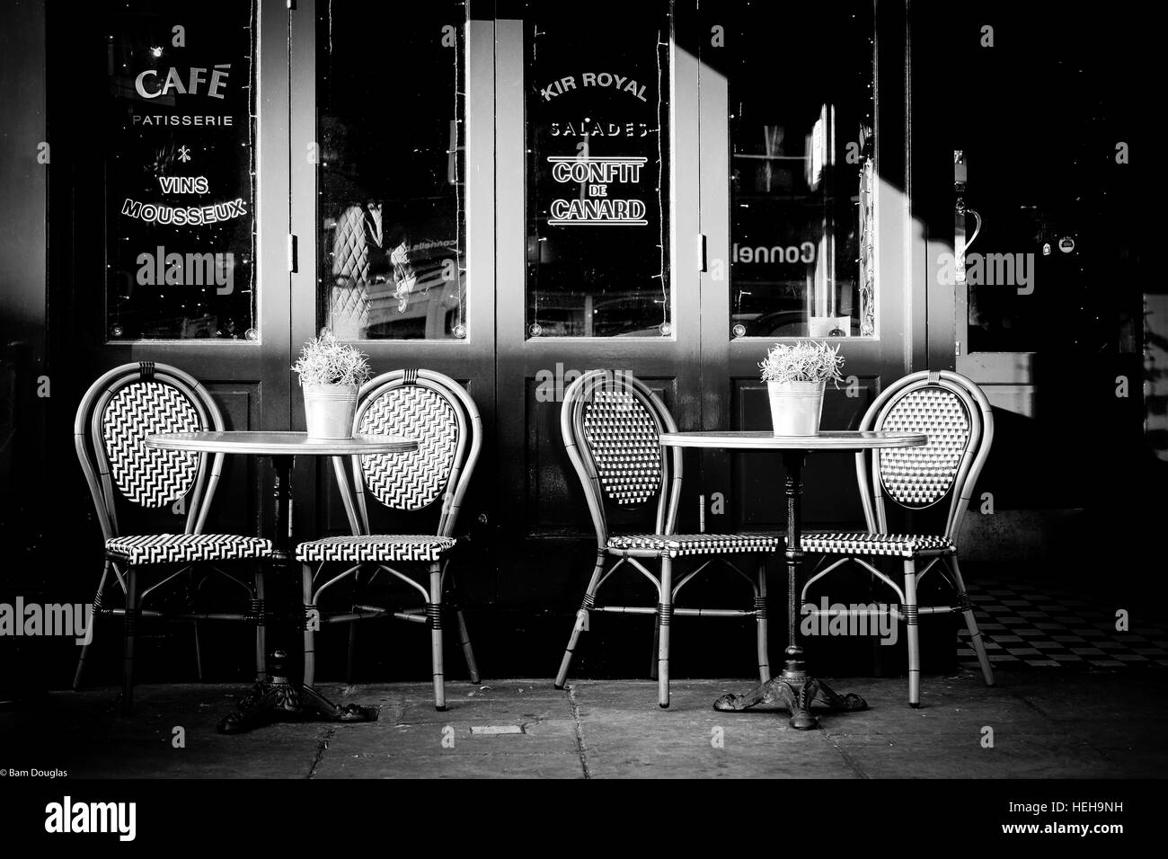 Exterior shot of table and chairs outside a French café Stock Photo