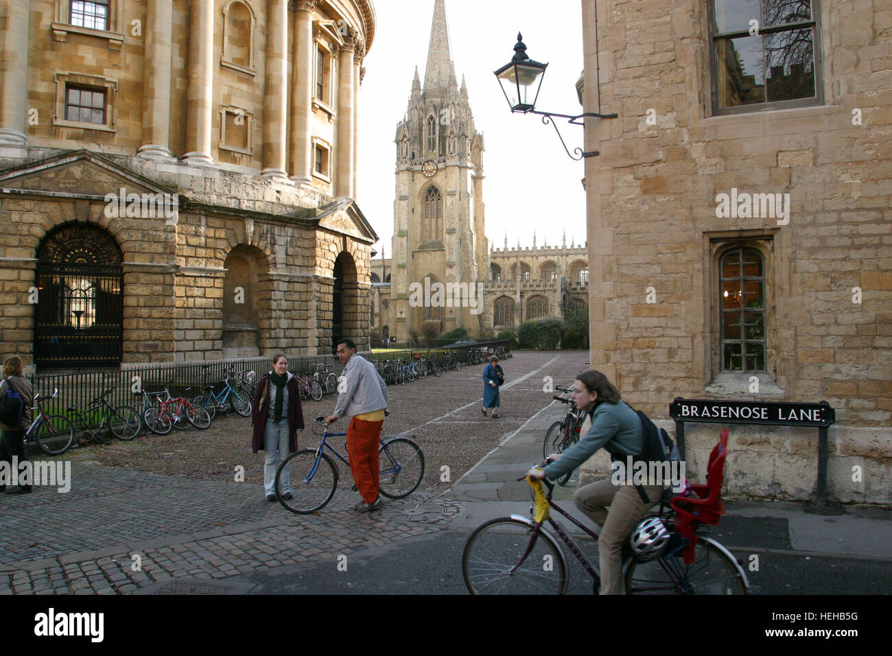 Oxford, England, Most students get around by bicycle or on foot at Oxford. Left is the Radcliffe Camera, centre St. Mary's Chrurch and right Brasenose Lane. Stock Photo