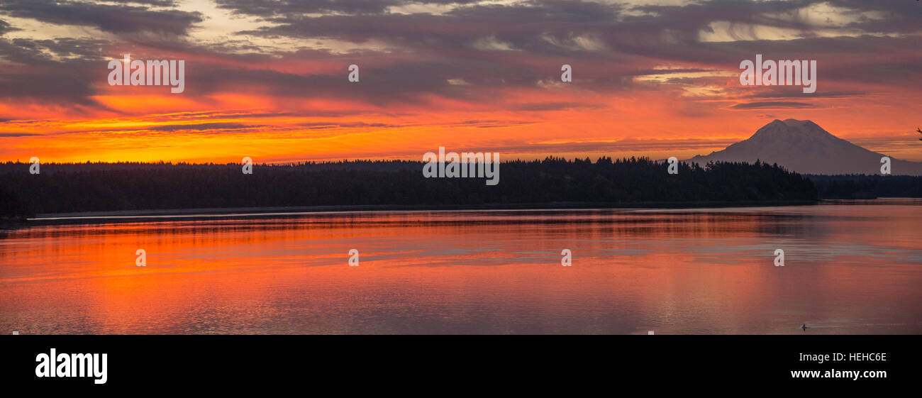Colorful sunsrise with Mr. Rainier in foreground. Puget Sound, Wahingtron, USA Stock Photo