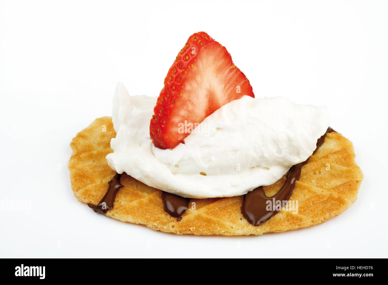Waffle topped with whipped cream and a strawberry Stock Photo - Alamy