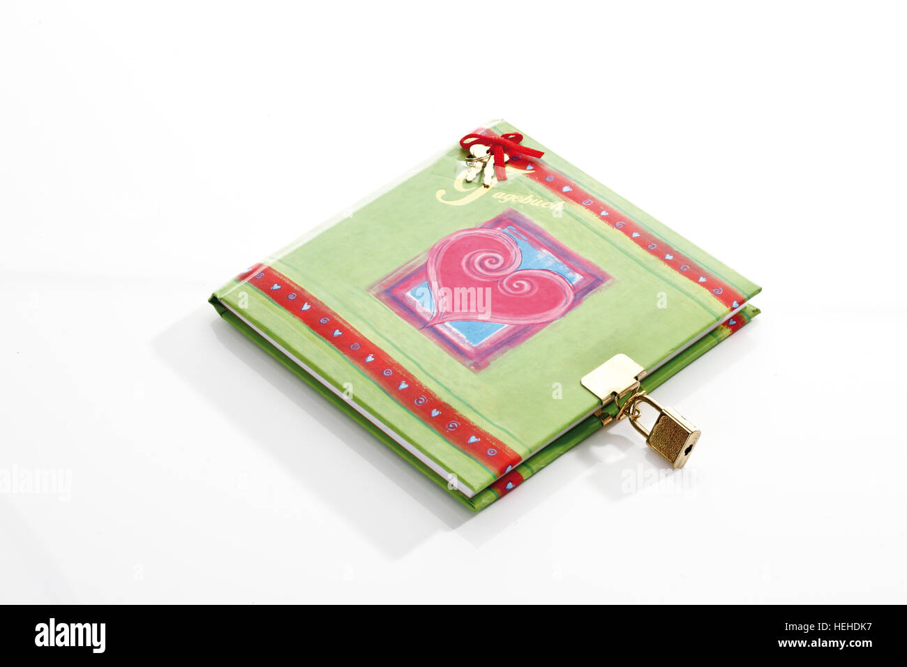 Ornate green diary locked with a padlock, lock, decorated with hearts and ribbons Stock Photo