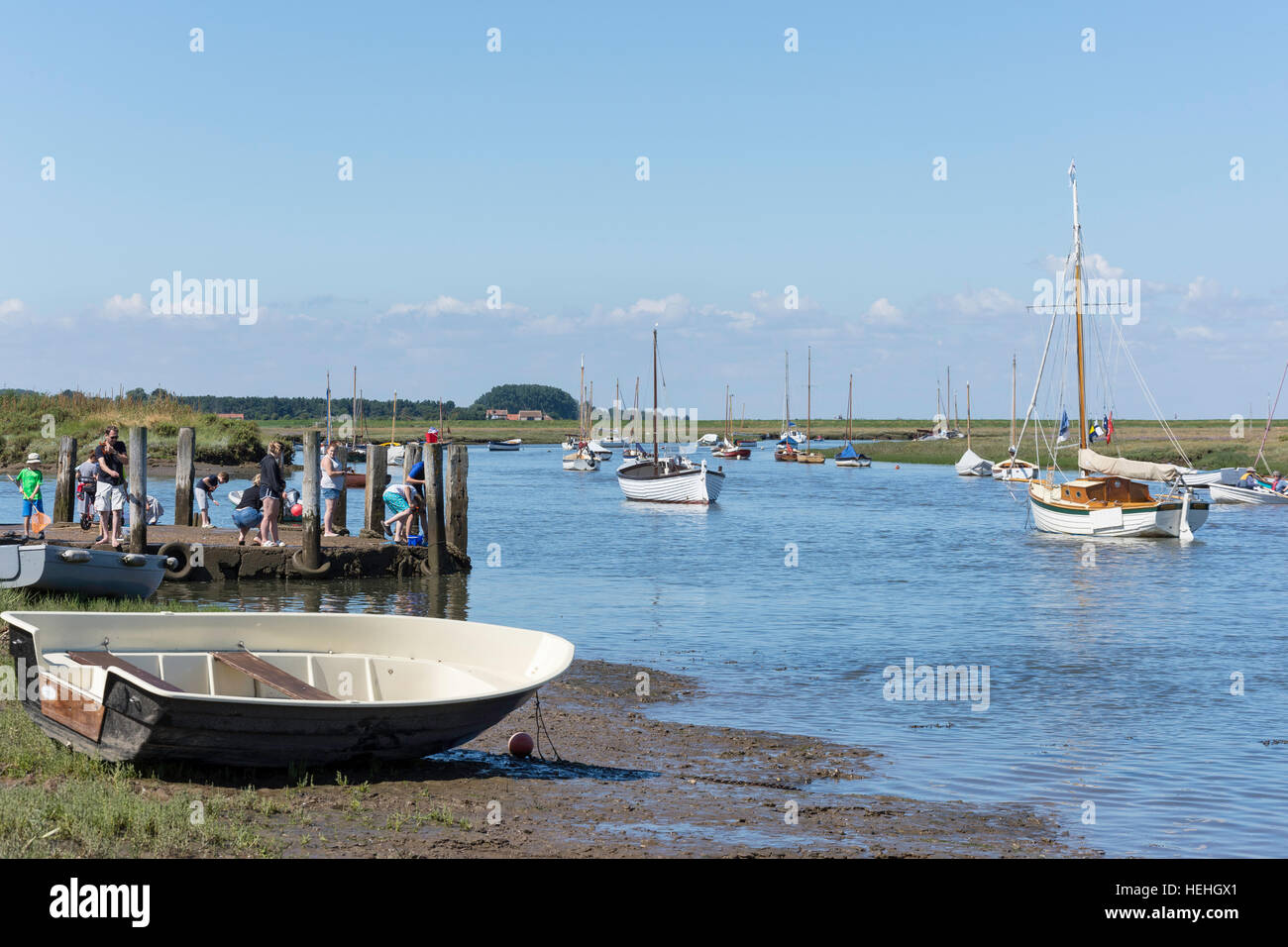 Traditional sailing boats on River Burn from The Quay, Burnham Overy Staithe, Norfolk, England, United Kingdom Stock Photo