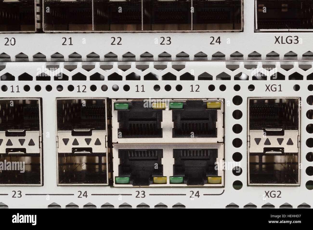 detail of fiber optic gigabit ethernet switch with SFP module slot and UTP category 5 connectors RJ-45 Stock Photo