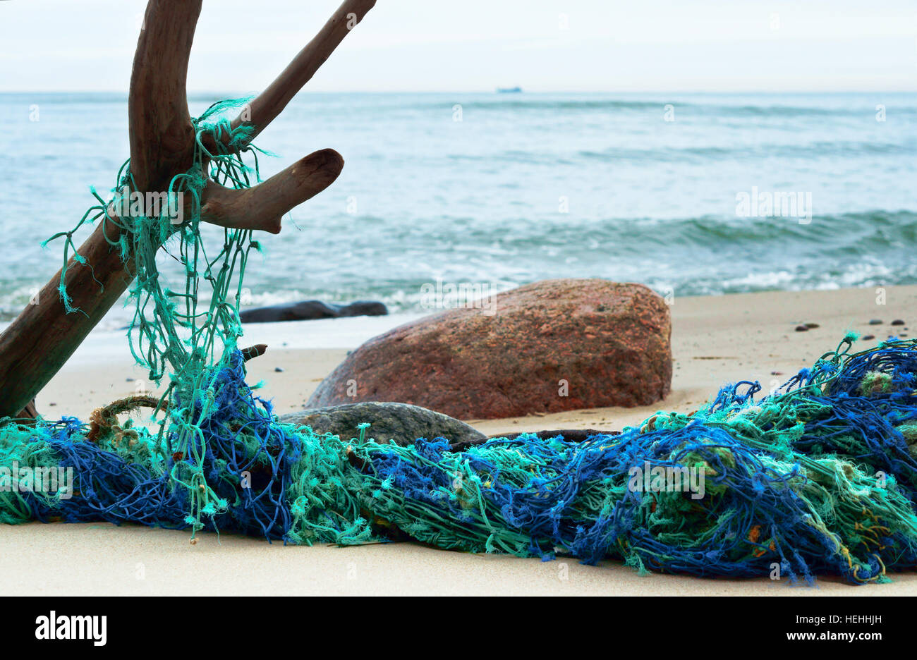 Normandy, France. Colorful fishing net drying on pier after