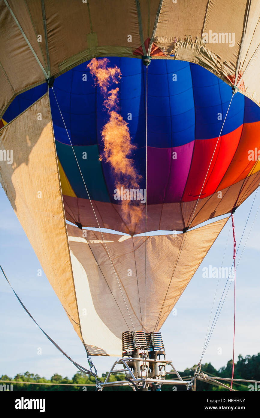 Colorful hot air balloon in blue sky at sunset Stock Photo - Alamy