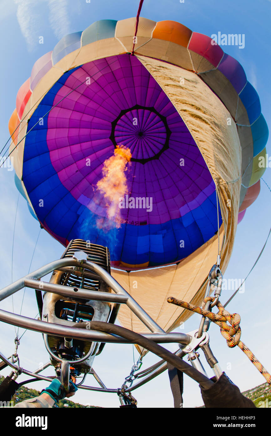 Colorful hot air balloon in blue sky at sunset Stock Photo - Alamy