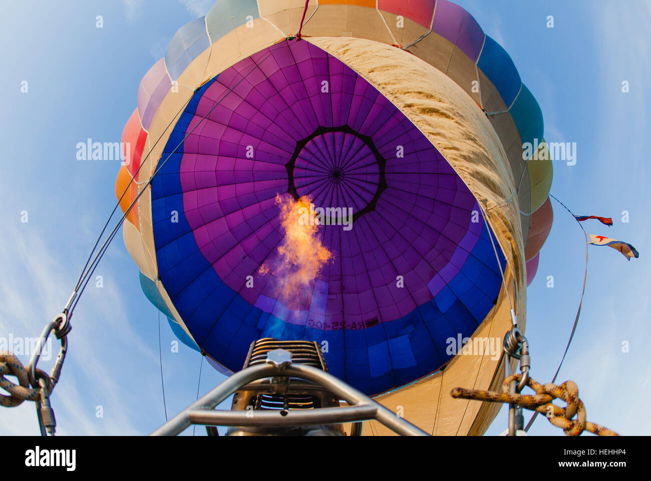 Colorful hot air balloon in blue sky at sunset Stock Photo - Alamy