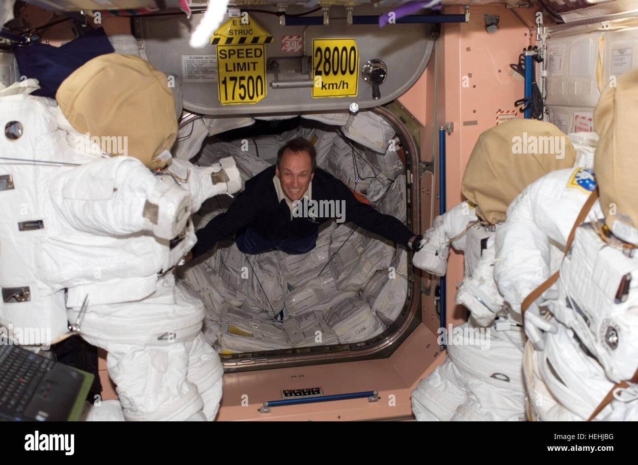 NASA STS-115 mission crew member Canadian astronaut Steve MacLean of the Canadian Space Agency floats into the Unity Node 1 on the International Space Station September 11, 2006 in Earth orbit. Stock Photo