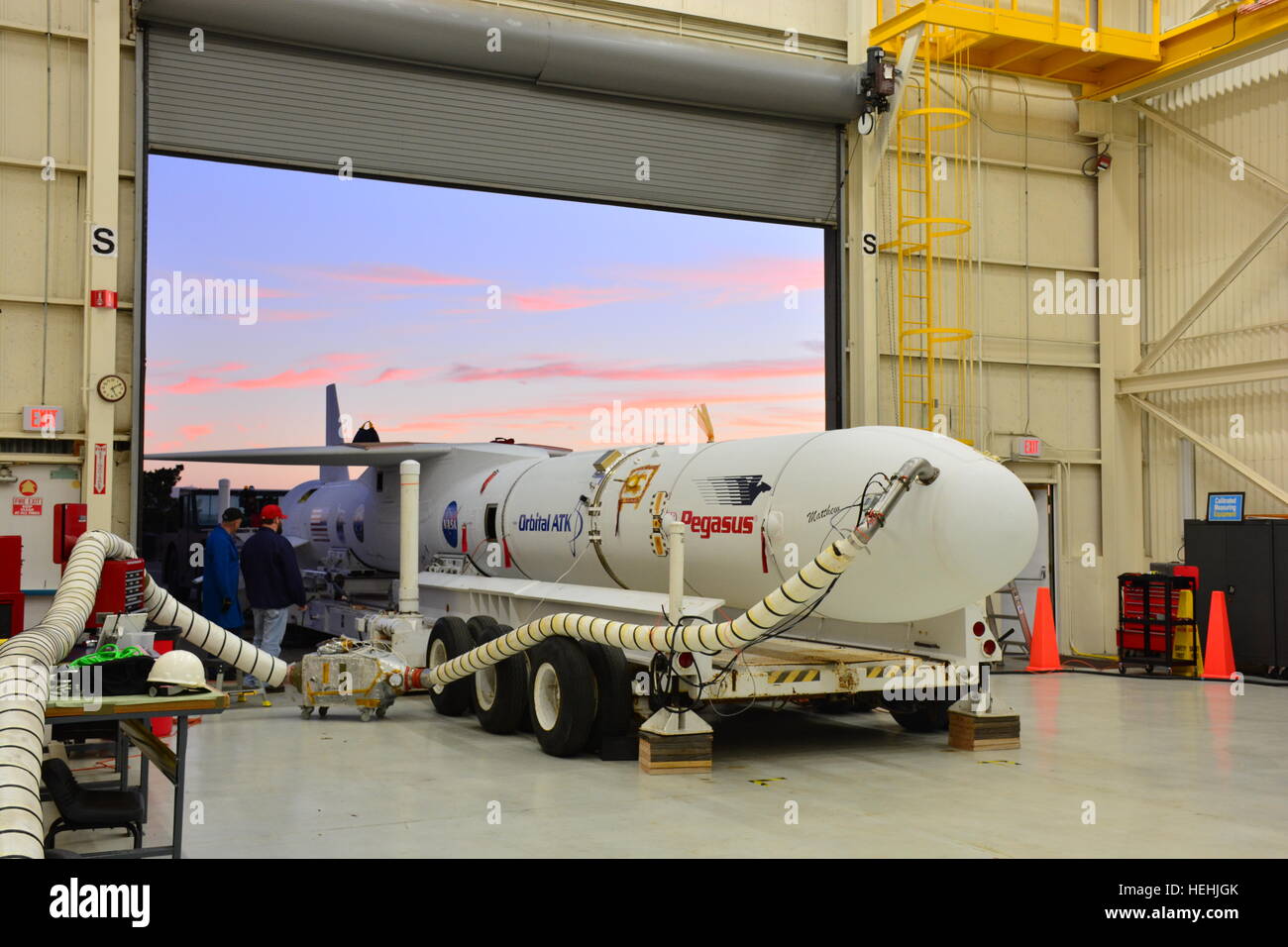 The Orbital ATK Pegasus XL rocket with NASA CYGNSS spacecraft on board is placed on an assembly integration transporter to depart the Vandenberg Air Force Base Building 1555 and mate with the L-1011 carrier November 17, 2016 near Lompoc, California. Stock Photo