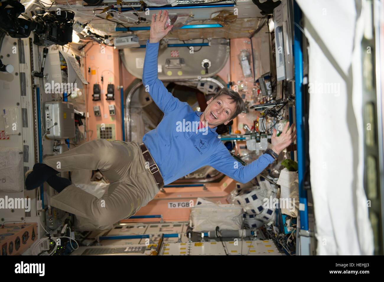 NASA Expedition 51 astronaut Peggy Whitson float through the International Space Station Unity module November 28, 2016 in Earth orbit. Stock Photo