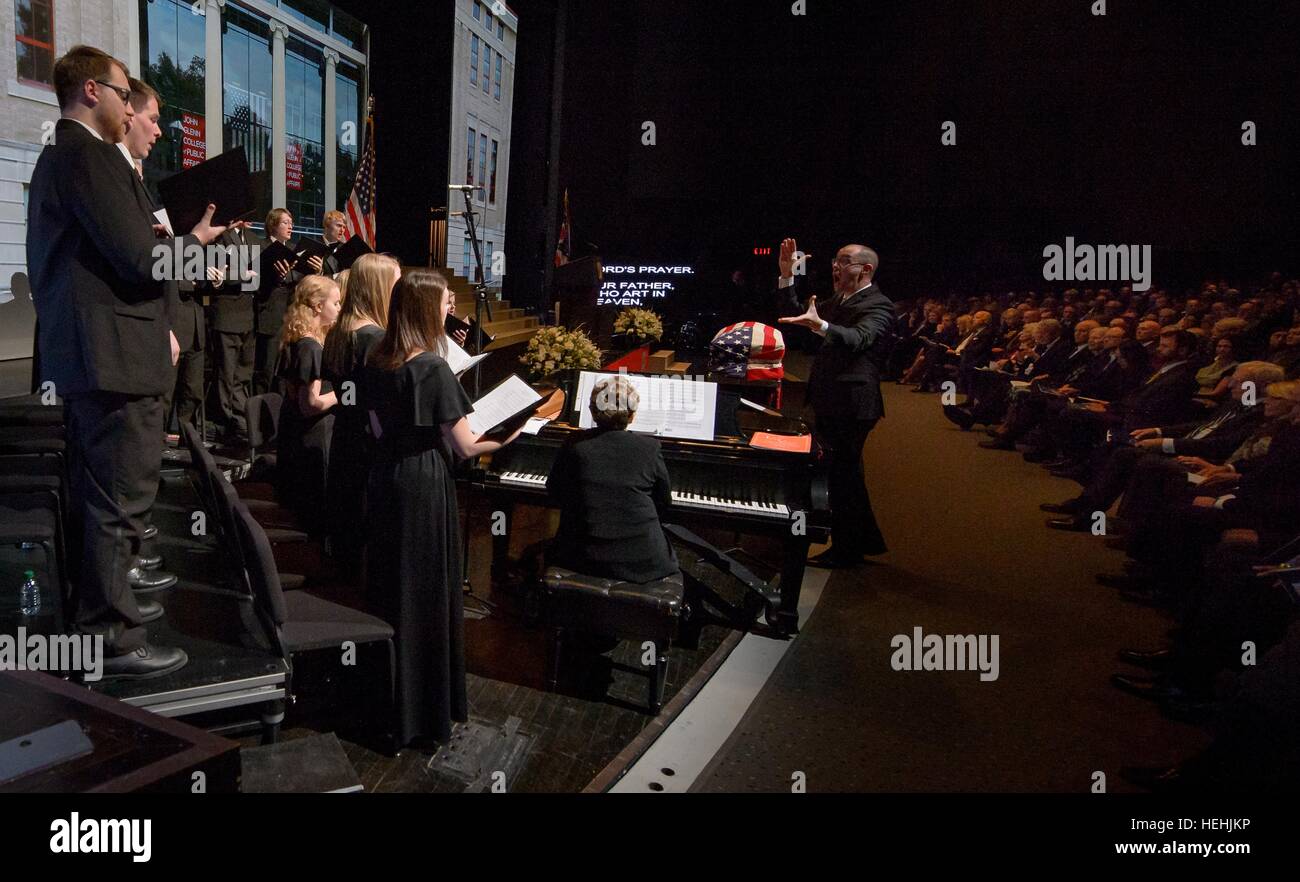 The Muskingum University Chamber Singers and pianist Dixie Lee Hayes Heck perform the Lords Prayer under the direction of Conductor Zebulon Highben during a memorial service celebrating the life of former NASA astronaut and U.S. Senator John Glenn at the Ohio State University Mershon Auditorium December 17, 2016 in Columbus, Ohio. Stock Photo