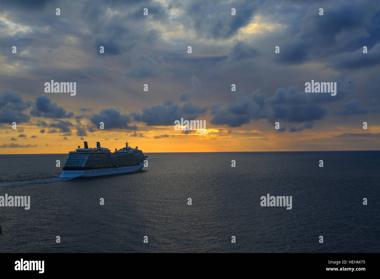 Cruise ship sailing in ocean during the sunset with colorful sky Stock ...
