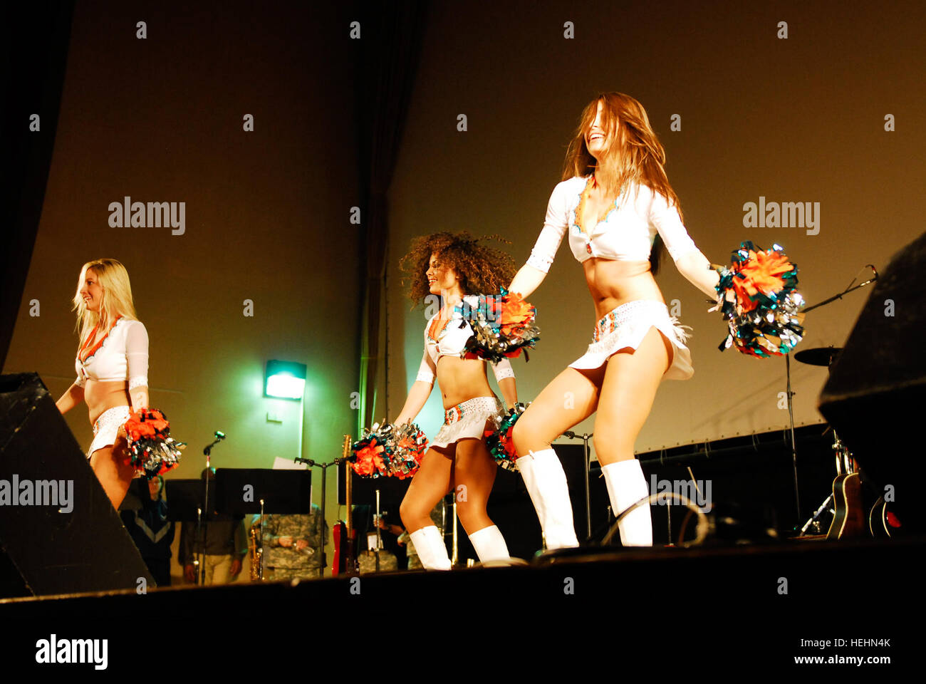 Miami Dolphin Cheerleaders Ariana Aubert, Kayla Patterson and Lilly Robbins performing at the Sgt. Maj. of the Army's Hope and Freedom Tour at Joint Base Balad, Iraq on Dec. 21. Dolphins Cheerleaders Balad Stock Photo
