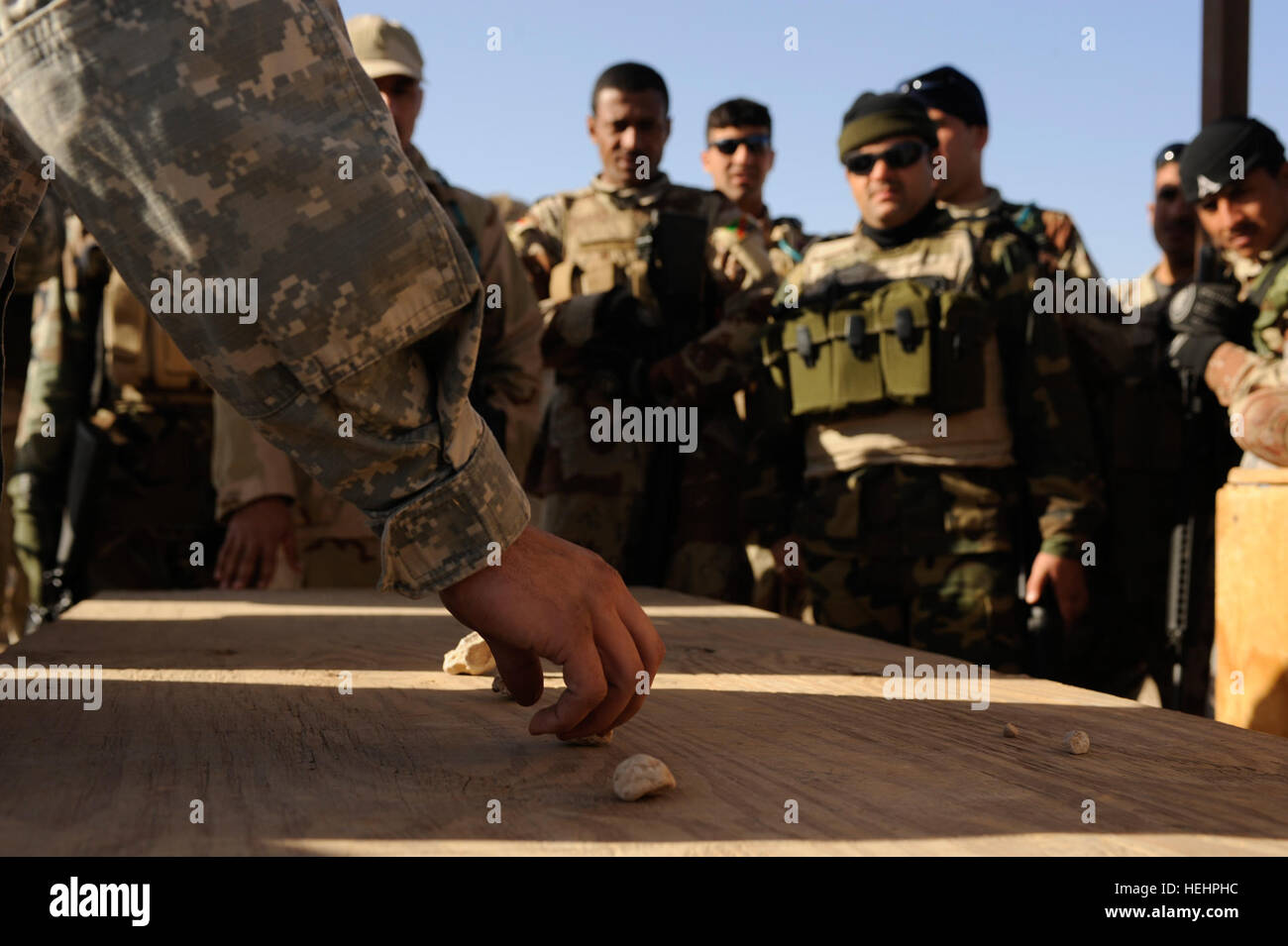 Infantry Rocking A U.S. Soldier explains vehicle movement tactics to Iraqi soldiers from ...