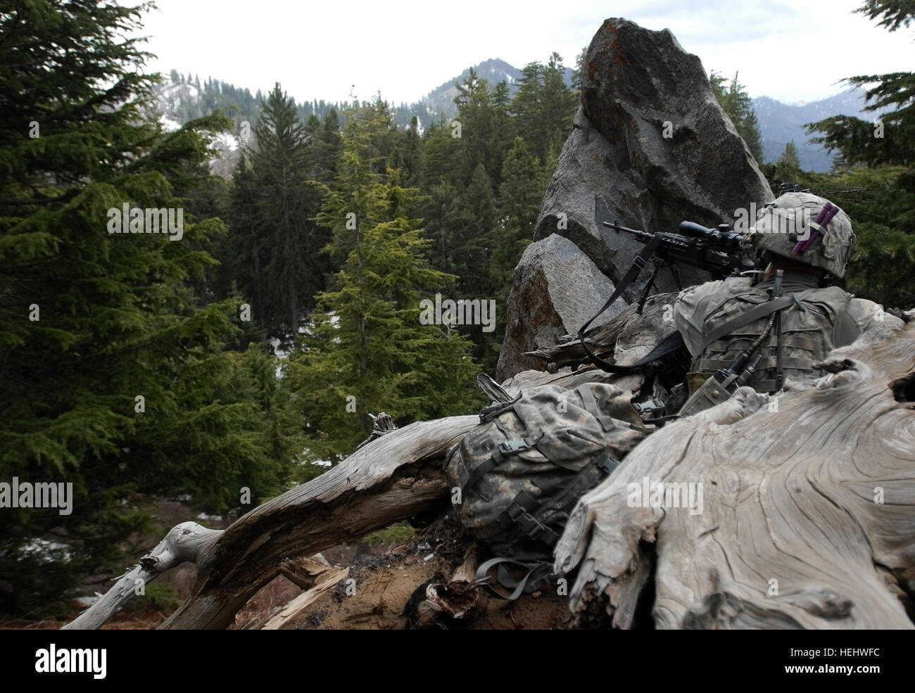 Cpl. Thomas Bourget watches over the mountains surrounding the Korengal