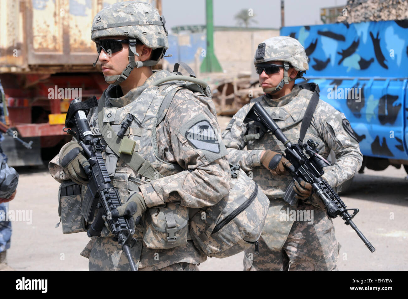 U.S. Soldiers of 1st Battalion, 82nd Field Artillery Regiment, 3rd Brigade  Combat Team, 82nd Airborne Division provide security during a joint patrol  with Iraqi police near Coalition Outpost Cashe South in Baghdad