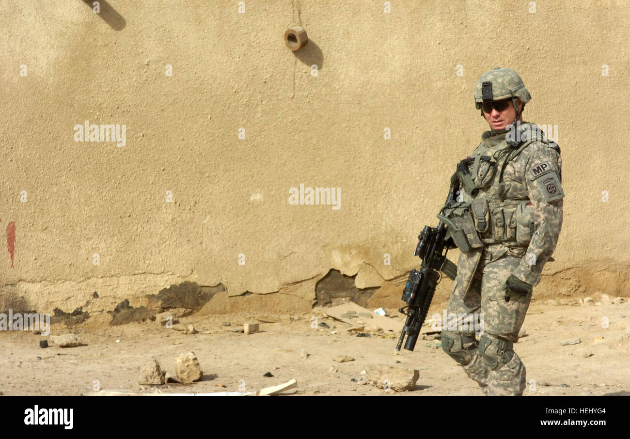 Sgt. Andy Zeigler, of Fort Worth, Texas, looks at vehicles traveling ...