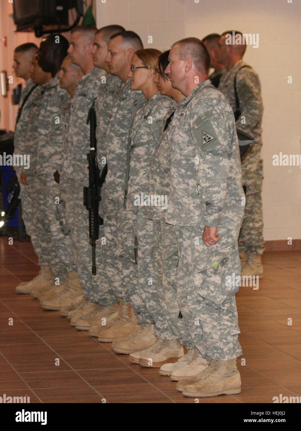 A Guardsman from the 192nd Military Police Battalion, Sgt. John Mensah, 3rd from left, stands with fellow unit members in recognition for outstanding performance during their mobilization training at Fort Bliss, Texas. Mensah is originally from Ghana, West Africa, and became a U.S. naturalized citizen July 2. Ghanaian Receives U. S. Citizenship Before Deploying to Iraq 189689 Stock Photo