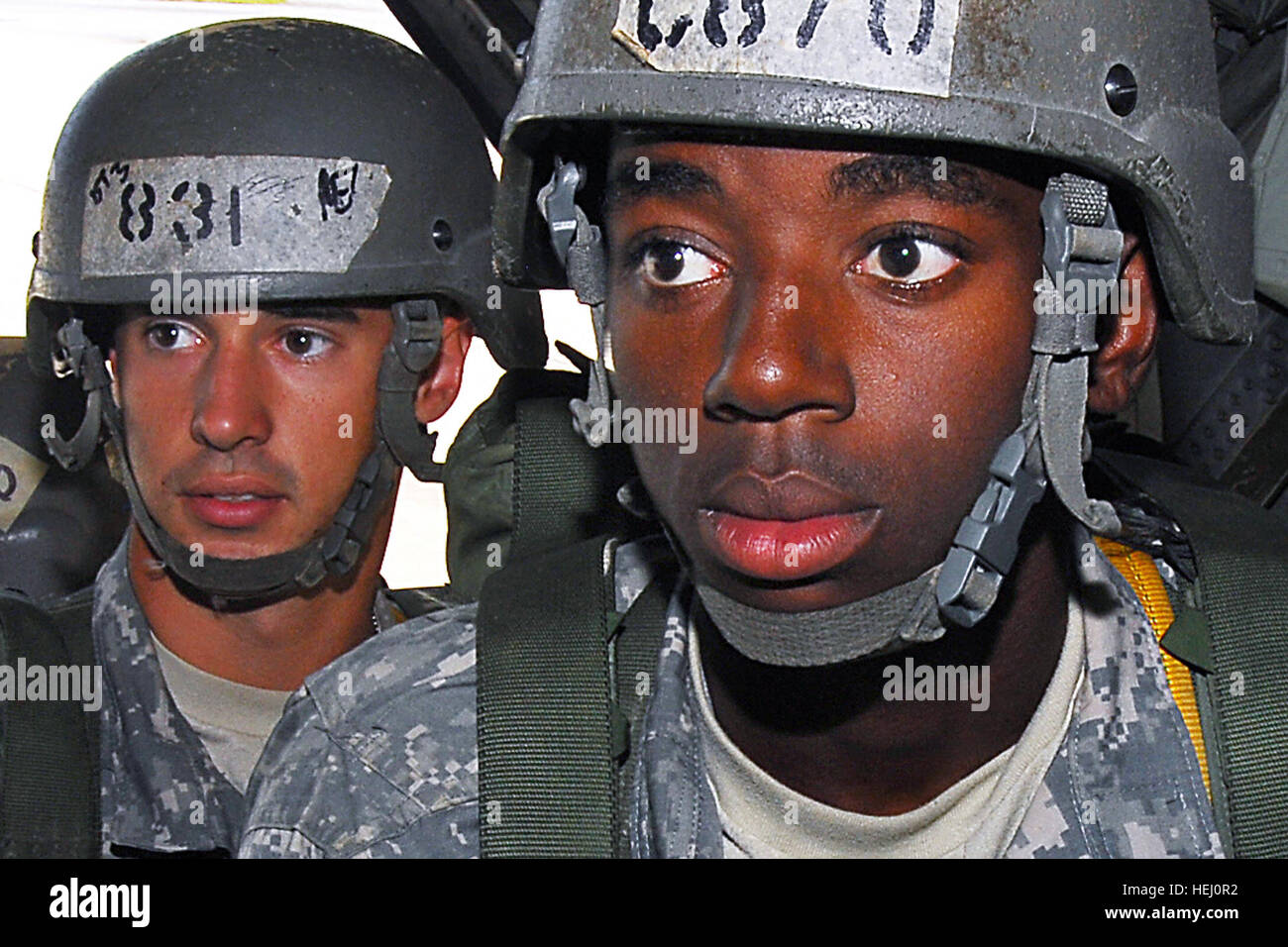 FORT BENNING, Ga., - U.S. Army Cadet Bernard Wheeler (right) and U.S. Army Pvt. Daniel Shirer, both students with the U.S. Army Airborne School, board a C-130 for their first parachute jump with combat equipment at Fort Benning, Ga.,  July 21, 2009. "I was nervous, but you've got to be tough to be Airborne," Wheeler said, after successfully completing the jump. The students  are in their final phase of parachute training, known as "jump week." They are assigned to Company B, 1st Battalion (Airborne), 507th Parachute Infantry Regiment. The company began with 525 students July 6, but only 424 ma Stock Photo