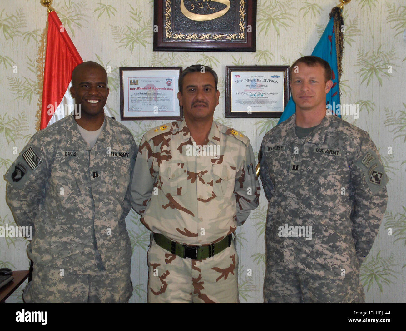 Capt. John Davis, Company commander of the 50th MRBC, 5th Engineer Battalion, Fort Leonard Mo. and Capt. Matthew Wagoner, Alpha Company commander, 37th Enginer Battalion, Fort Bragg N.C., met with Col Ha'Meed the 4th Iraqi Army Field Engineer Regiment Commander at COL Spider in efforts to establish future partnership opportunities. Engineer Soldiers visit with children, Iraqi army leaders 196088 Stock Photo