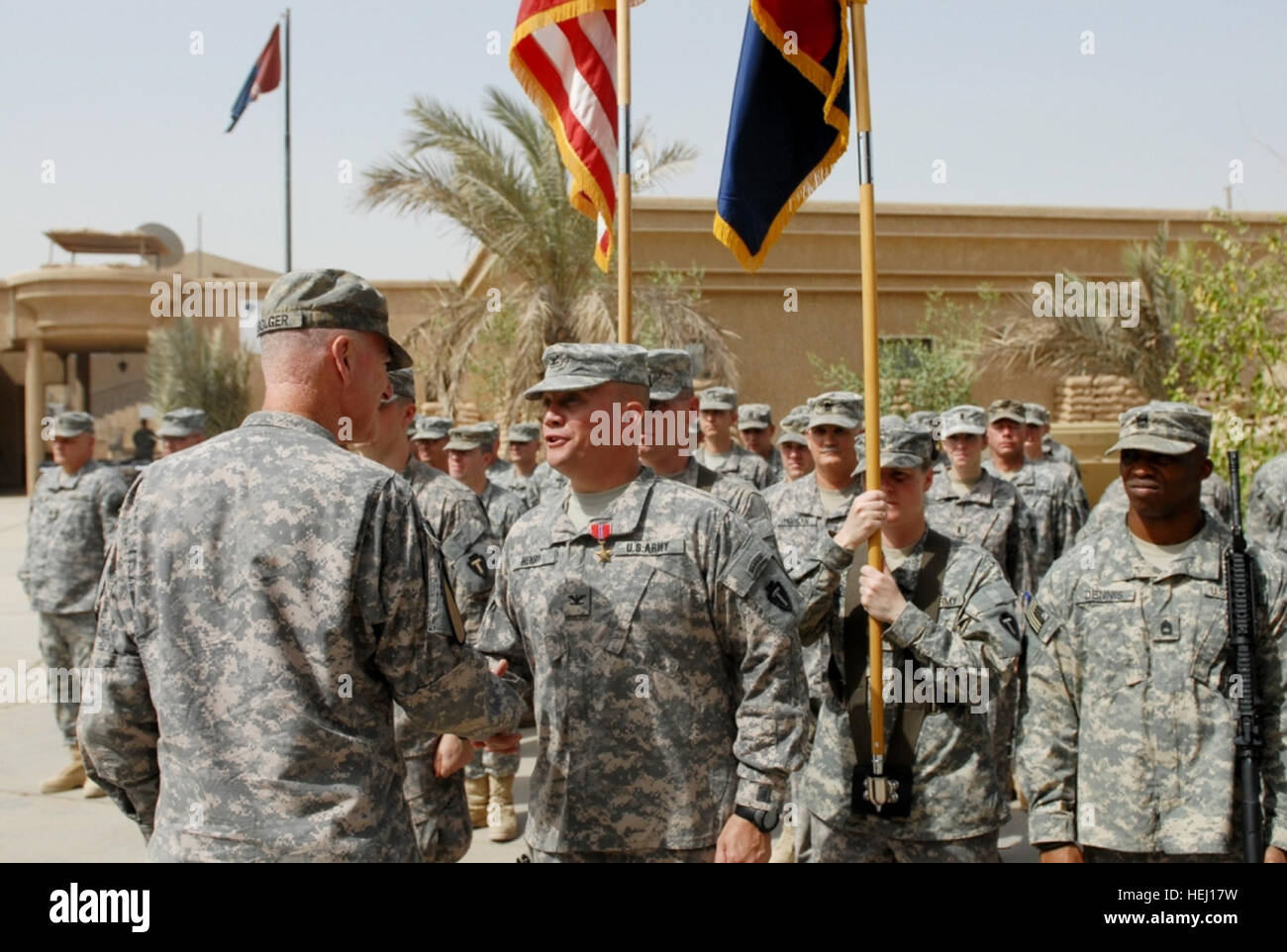 A commanding general presents the Bronze Star Medal to the commander of ...