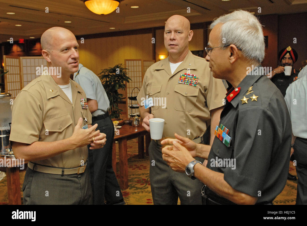 HONOLULU, Hawaii - (from left) Maj. Richard Howell, Marine Forces, Pacific South Asia desk officer, Col. Fred Jameson, Director of Training and Exercises, MARFORPAC, and Brig. Gen. Jatinder Sikand, India Defense Attache to the U.S., build relationships during the India ESG. Maj. Richard Howell, Col. Fred Jameson and Brig. Gen. Jatinder Sikand speaking during the India Executive Steering Group Stock Photo