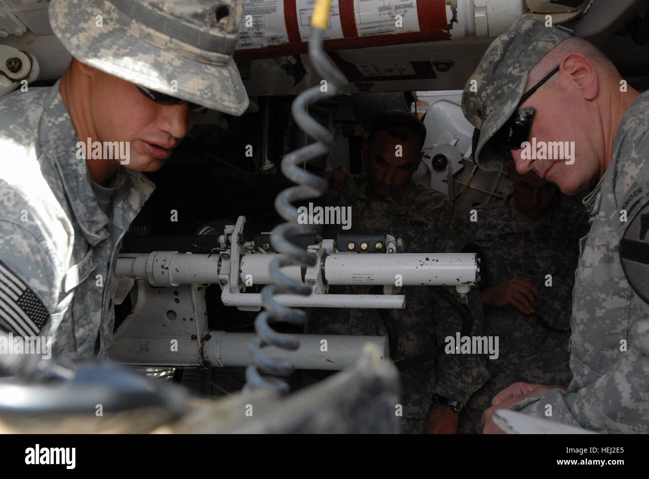 Killeen, Texas, native, Spc. Melton (left), an artillery cannon