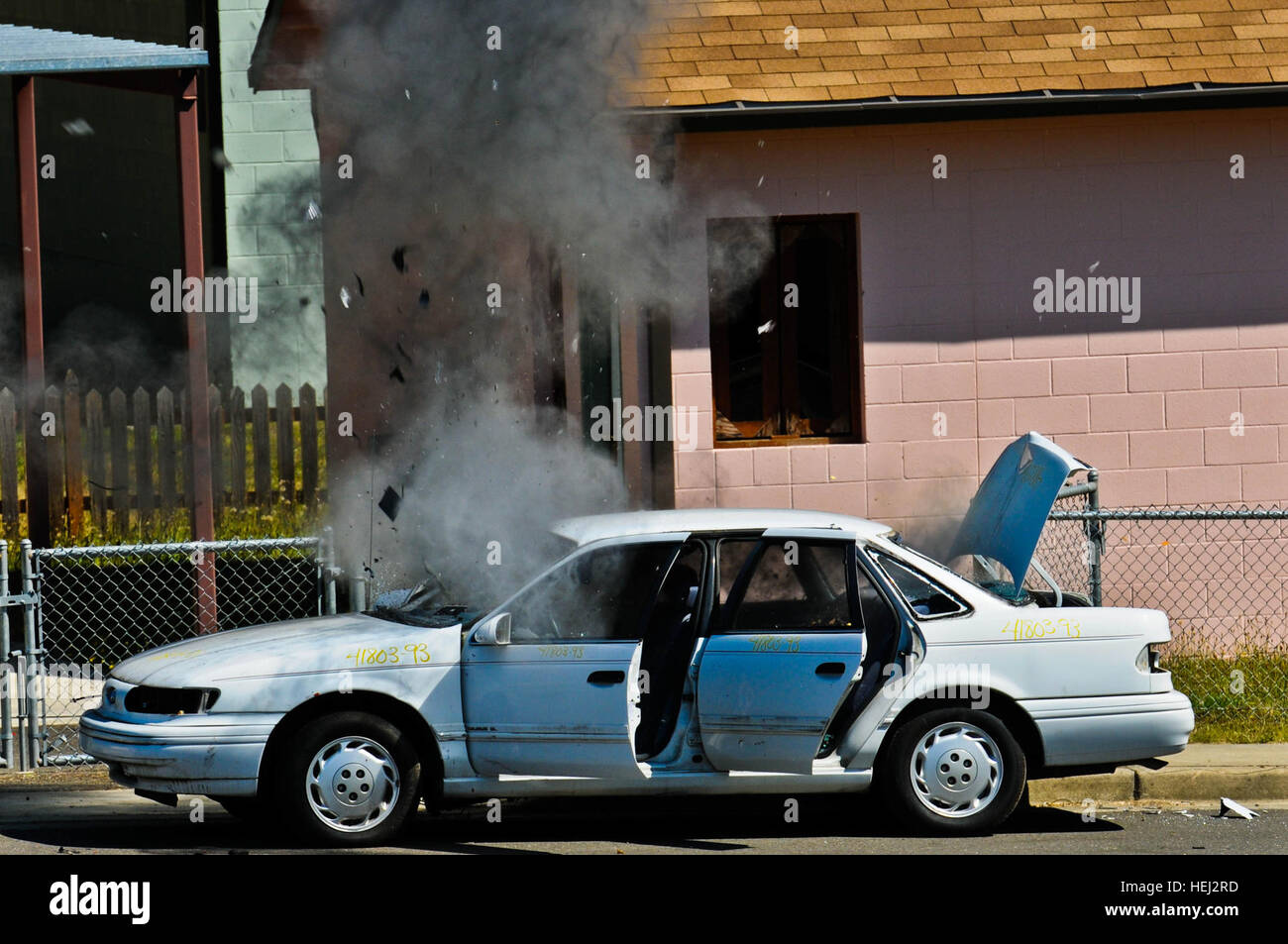 A simulated improvised explosive device inside a sedan is neutralized ...