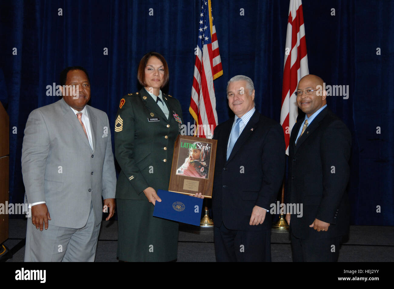 After receiving the 2009 Latina Style Distinguished Service Award, Master Sgt. Erika Gordon, currently deployed with the 130th Engineer Brigade, as its equal opportunity advisor, gathers for a keepsake photo with (left to right) Clarence A. Johnson, acting deputy undersecretary of defense for Plans; Robert Bard, president & CEO, Latina Style; and Jerry Dillard, a Department of the Army representative. US Army 51887 Equal Opportunity advisor receives 'Latina Style' award Stock Photo