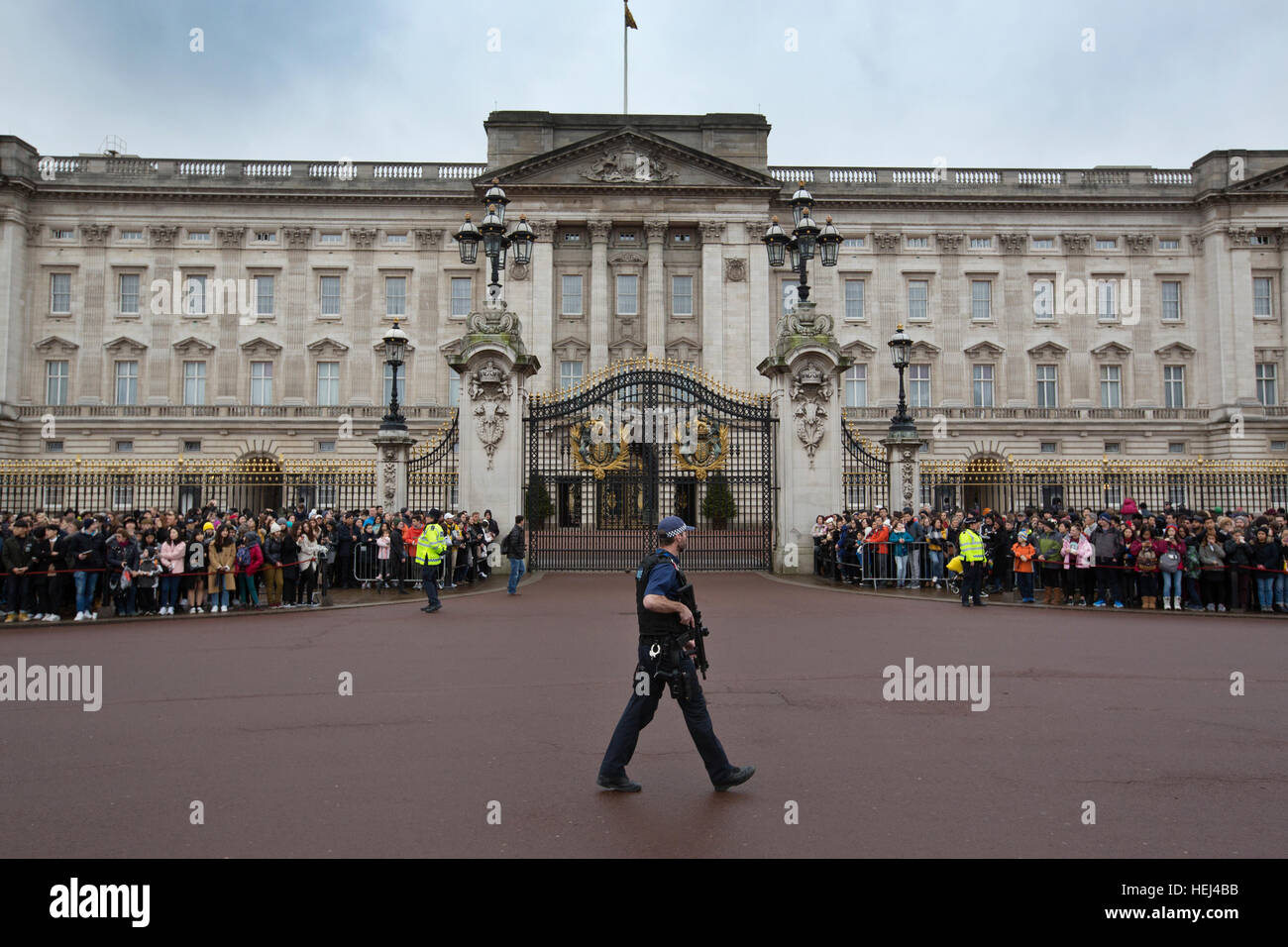 Armed police provide security during the Changing of the Guard outside