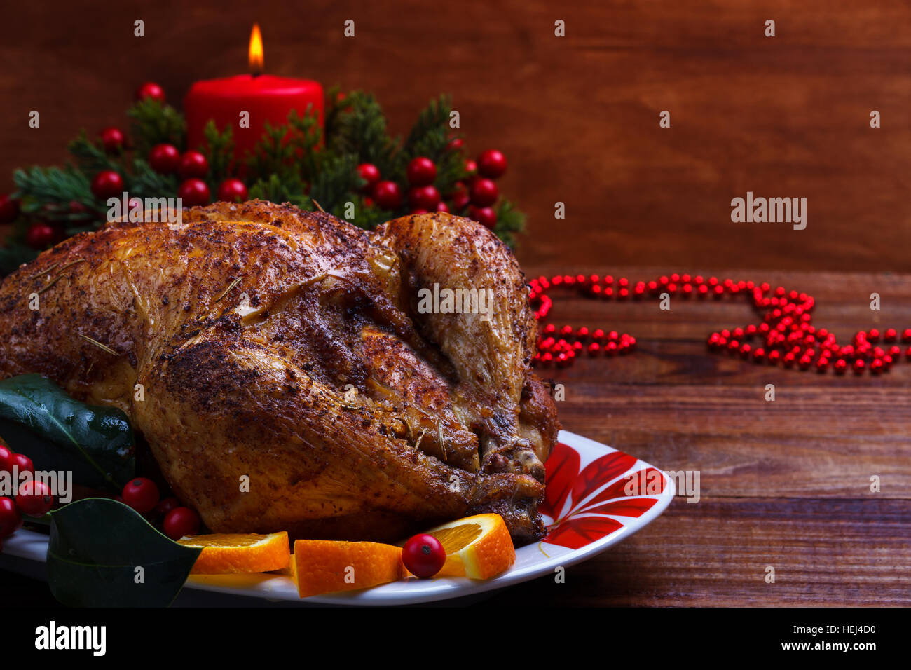 Roasted whole chicken with Christmas decoration. Wooden background ...