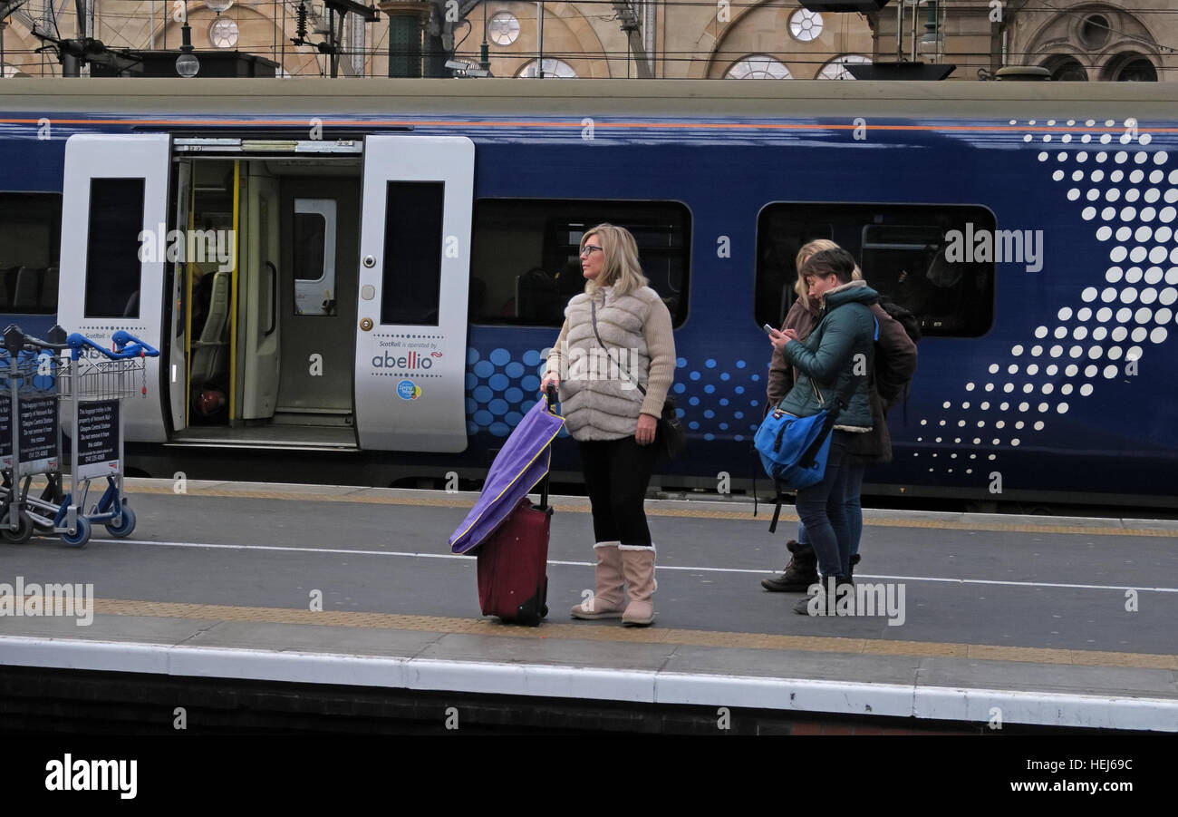 Scotrail Abellio train carriages & passengers,petition to bring back into state ownership,after poor service Stock Photo